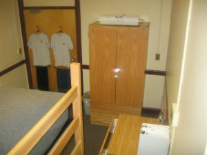 A view of a typical dorm room showing the door